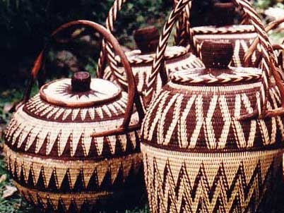 three woven baskets sitting on the ground