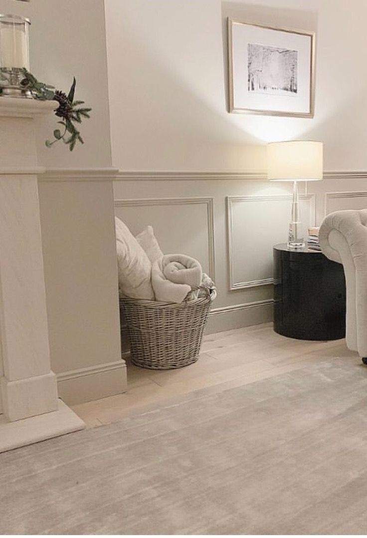 a living room filled with furniture and a fire place next to a white fireplace mantel