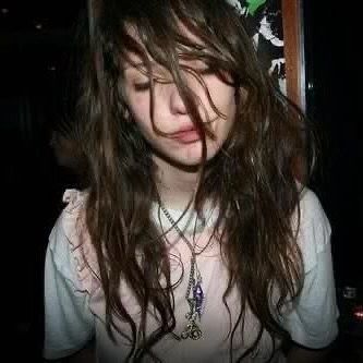 a close up of a person with long hair