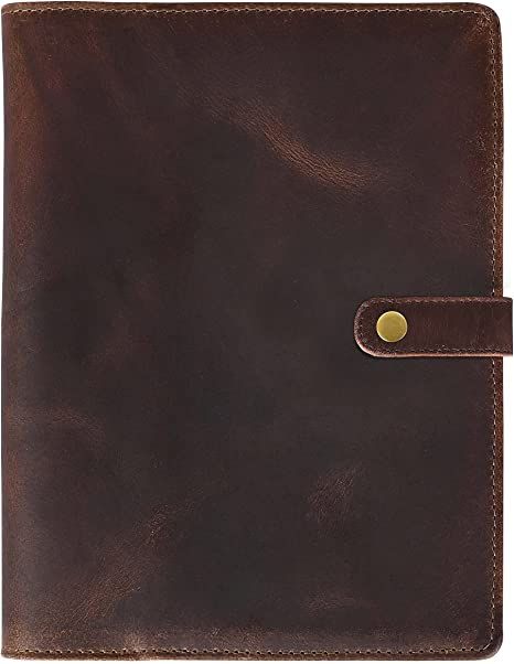 a brown leather notebook with a gold button