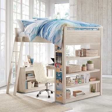 a loft bed with bookshelf and desk underneath it in front of a window