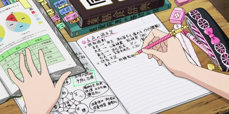 someone is writing in an open notebook on a desk next to a calculator