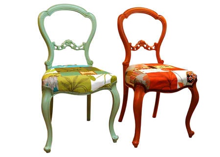 two chairs that have been painted to look like they are sitting next to each other