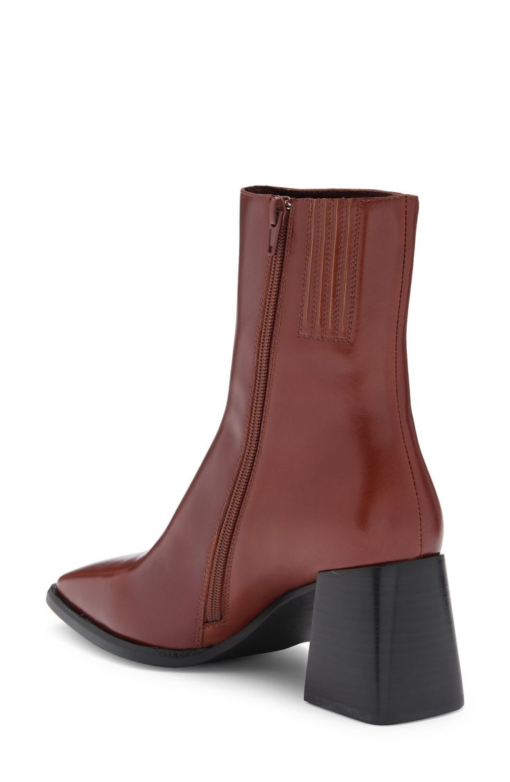 A squared-off toe and flared block heel balance a sleek leather bootie furnished with a side zipper for easy entry. 2 1/2" heel (size 8.5) 6 1/4" shaft (size 8.5) Side zip closure with elastic gore inset Leather upper/leather and textile lining/synthetic sole Imported Fall Platform Boots With Zipper And Square Toe, Formal Boots With Zipper Closure And Block Heel, High Ankle Boots With Stacked Heel For Office, Modern Business Boots With Zipper Closure, Formal Block Heel Boots With Zipper Closure, Formal Block Heel Boots With Zipper, Formal Block Heeled Boots With Zipper, Modern Fall Boots With Stacked Heel, Brown Boots With Zipper Closure And Block Heel