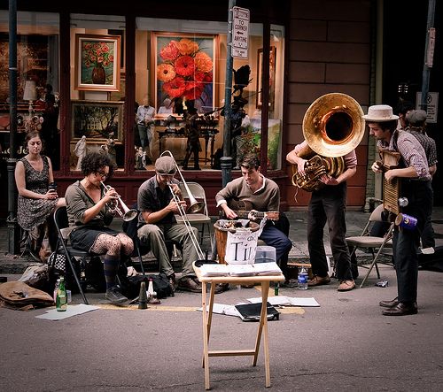 a group of people playing instruments on the street