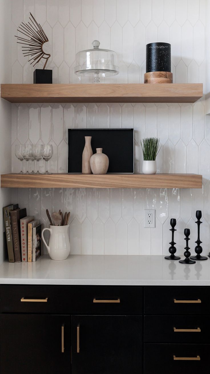 the shelves in this kitchen are filled with vases, books and other decorative items