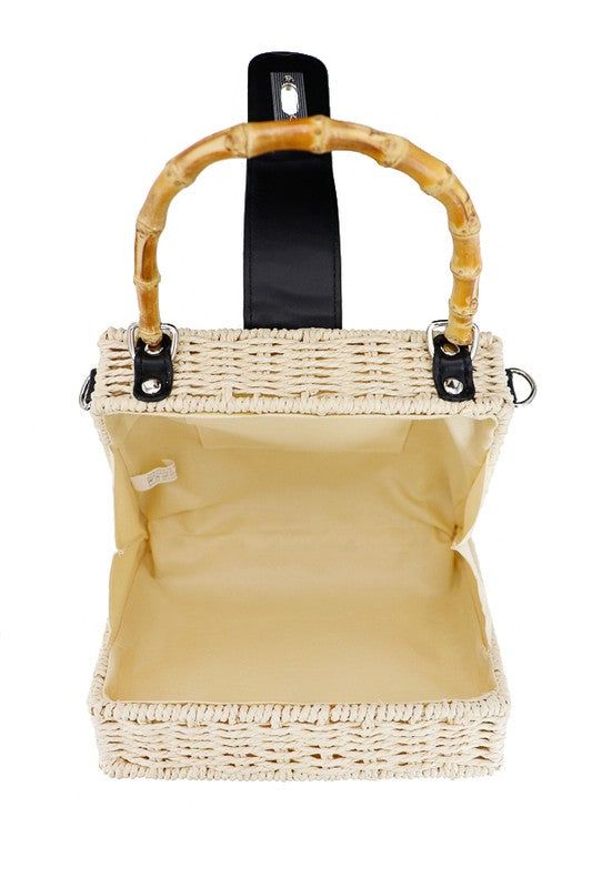 Turn lock closure bamboo handled ratttan straw box wicker basket bag 8" x 6" x 3.25" 100% wicker shell100% faux leather trim100% cotton lining Wipe clean with cloth Chic Basket Straw Bag With Top Carry Handle, Beige Basket Straw Bag With Top Carry Handle, Chic Straw Bag With Bamboo Handle For Picnic, Summer Square Straw Bag With Detachable Handle, Casual Rectangular Straw Bag With Bamboo Handle, Cream Rectangular Straw Bag With Bamboo Handle, White Rectangular Straw Bag With Bamboo Handle, White Straw Bag With Bamboo Handle, Square Natural Straw Bag With Detachable Handle