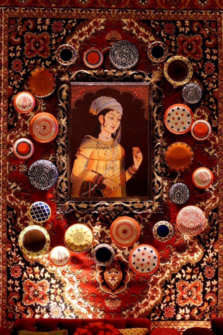 a painting on the wall with many different buttons and circles around it, including a man in a turban