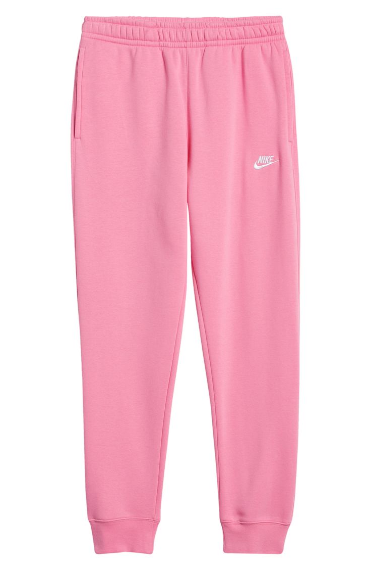 An embroidered Swoosh marks the pocket of these sweatpants made for comfort from fleece with a sporty fit that slims at the ankle. 28 1/2" inseam; 10" leg opening; 12 1/2" front rise; 16 1/2" back rise (size Medium) Elastic/drawstring waist Side-seam pockets; back welt pocket Cotton/polyester Machine wash, tumble dry Imported Nike Sweatpants Cute, Aeropastel Sweatpants Outfit, Womens Sweatpants Nike, Pink Nike Sweatpants, Nike Fleece Sweats With Pockets, Nike Sweatpants Pink, Nike Sweatpants Girls, Sweatpants And Hoodie Outfit, Sweat Pants