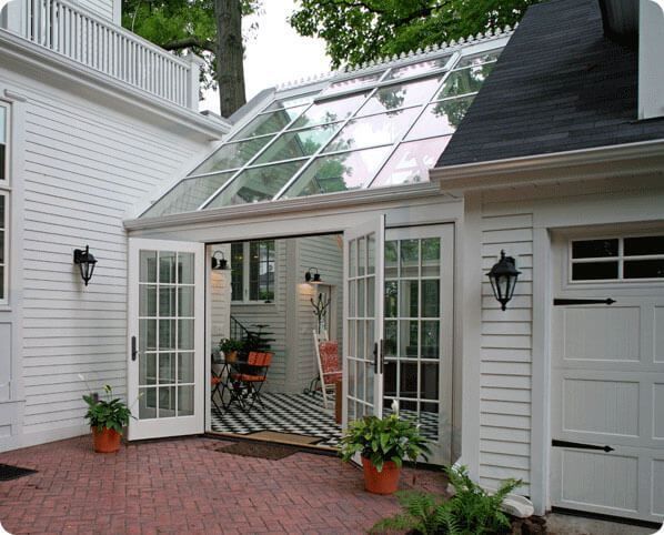 a white house with an orange brick patio