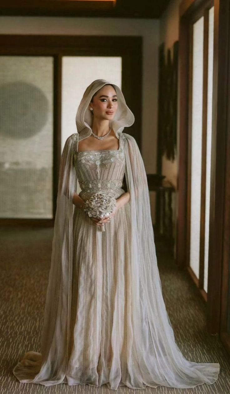 a woman in a wedding dress and veil