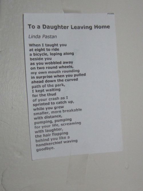 a piece of paper taped to the side of a wall with words written on it