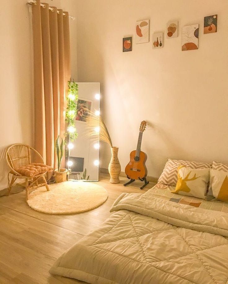 a bed room with a guitar on the wall