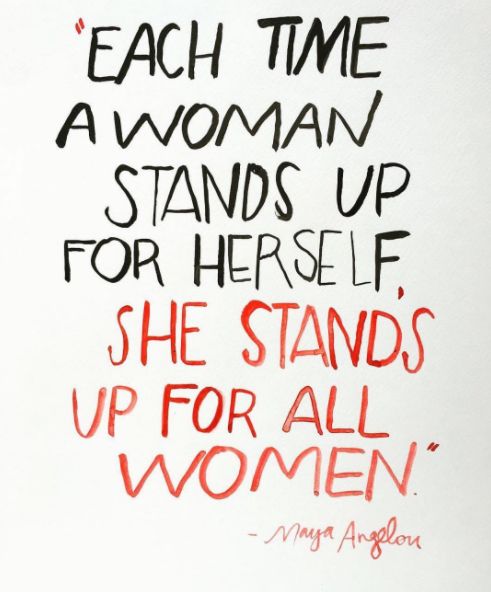 a handwritten sign with the words each time a woman stands up for herself she stands up for all women