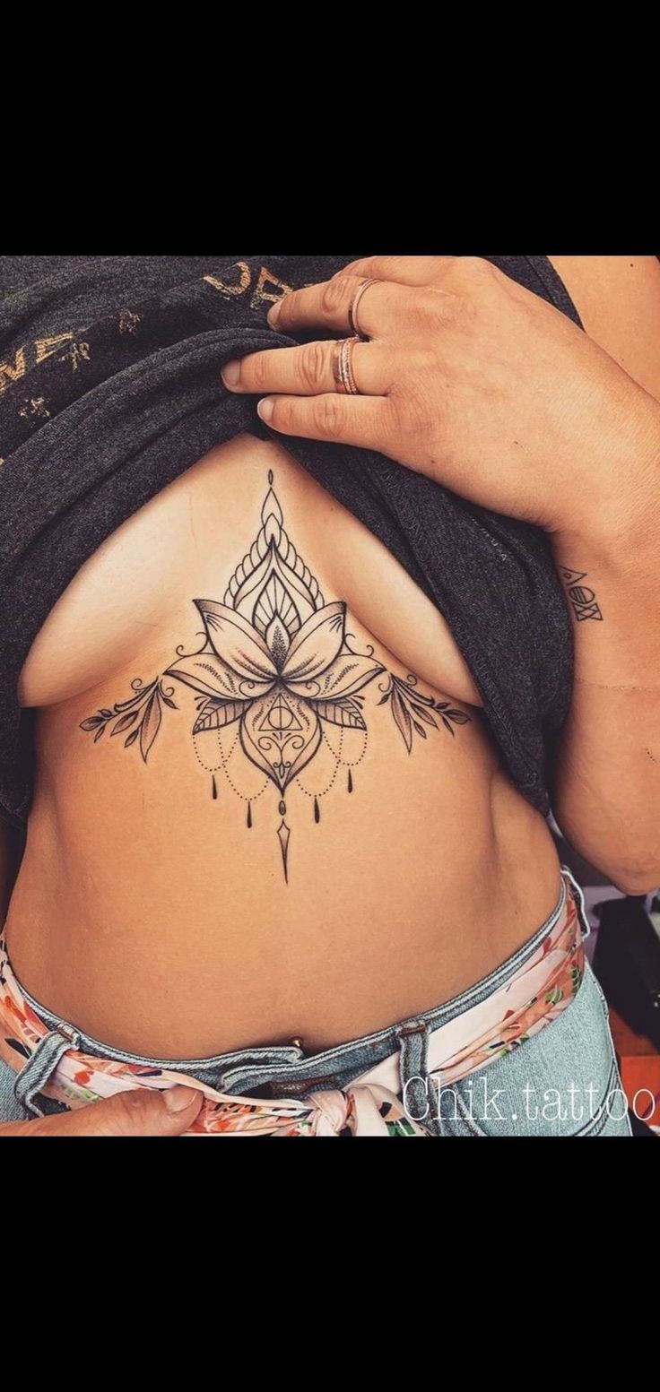 a woman with a tattoo on her stomach