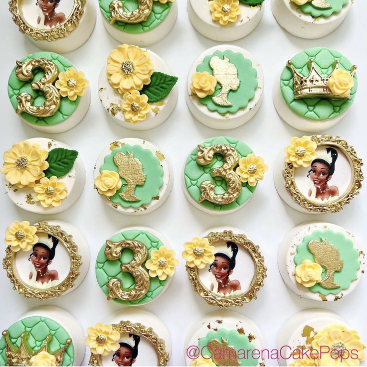 the cupcakes are decorated with princess and the frog images on them, as well as flowers