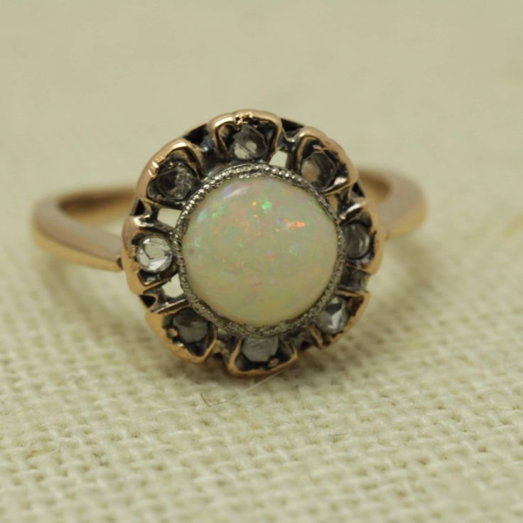 Victorian Opal Mine  Cut Diamond Ring 14k Rose Gold Size 6 14k Rose Gold Size 6 can be sized at a low cost  The Ring is 11.09mm across by 5.3mmin Height  Diamond 0.20ct total and Opal 0.62.ct It Comes with a new ring box item # 5869 Victorian Rose Gold Round Diamond Ring, Rose Gold Ring With Rose Cut Diamonds, Formal Rose Gold Opal Ring, White 14k Rose Gold Round Rings, White 14k Rose Gold Rings, Rose Gold Opal Ring With Prong Setting, Formal Rose Gold Opal Ring With Prong Setting, Rose Gold Round Opal Ring Fine Jewelry, Classic Rose Gold Opal Ring For Anniversary