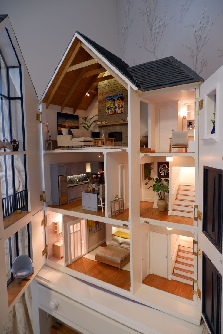 a doll house is shown with all the furniture in it