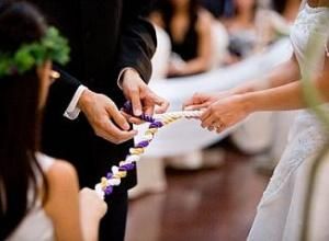 the bride and groom are getting ready to put their wedding rings on each others finger