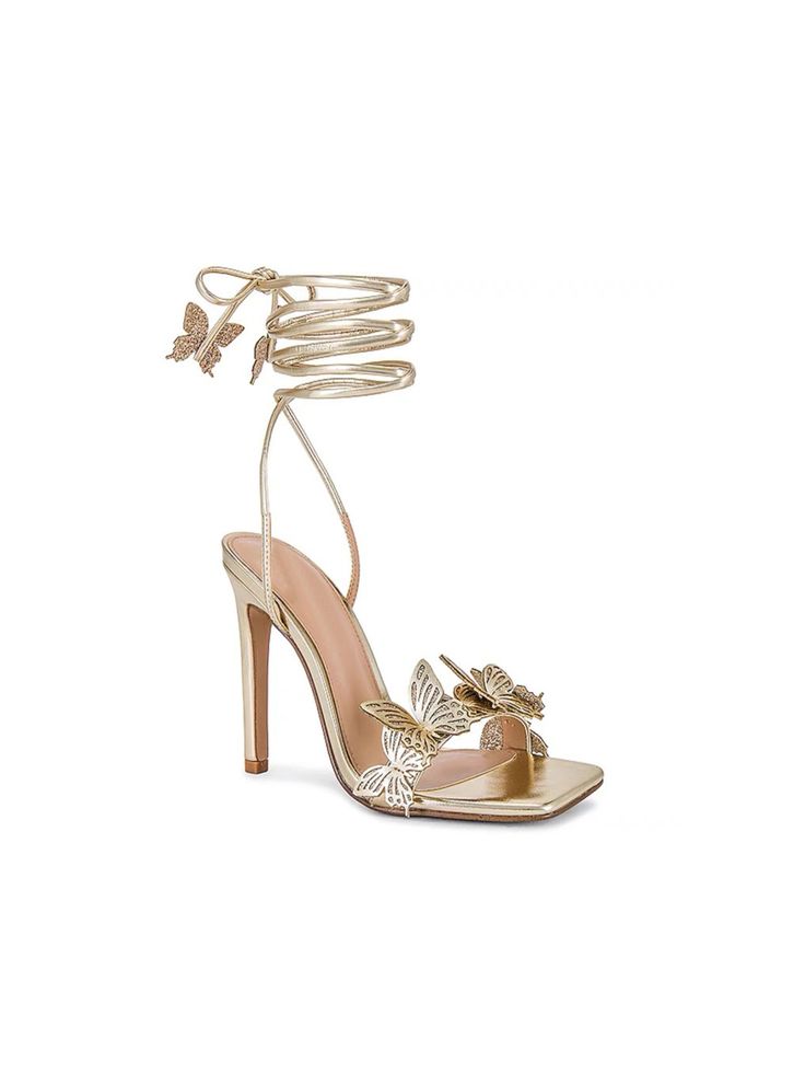 Elevate your style with these stunning Reina gold butterfly lace-up heels. Designed for the modern fashionista, these heels feature a striking butterfly motif that wraps elegantly around the ankle, adding a touch of whimsy and charm. The lace-up design provides a secure fit while showcasing an ultra-feminine silhouette. Crafted with a high stiletto heel, these sandals are perfect for special occasions, nights out, or adding a glamorous flair to any outfit. Details Elegant gold color with a gloss Elegant Lace-up Sandals With Block Heel For Evening, Gold Heels For Spring Formal, Gold Heels For Formal Spring Occasions, Gold Chic Heels For Gala, Elegant Lace-up Sandals For Spring, Gold Heels For Spring Evening, Chic Lace-up Sandals With Wrapped Heel For Party, Elegant Evening Lace-up Sandals For Spring, Elegant Lace-up Summer Heels