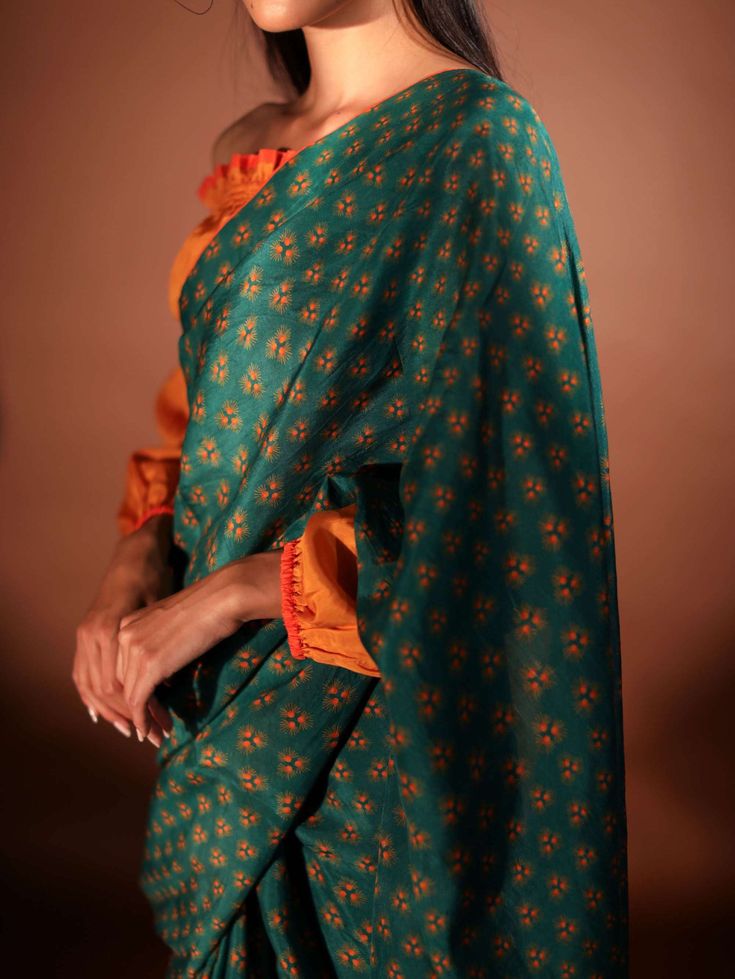 Editor's Note Printed Plain Sari With Contrast Fall And Piping Details. Note: Blouse worn by model is for styling purposes and can be purchased separately. Color: Green Fabric: Pure mulberry silk Care: Dry Clean Only About the Designer Pozruh is a fashion apparel brand that offers sustainable clothing through its innovative & circular business model. Green Silk Blouse With Floral Print, Printed Green Blouse Piece For Saree, Festive Green Blouse With Printed Motifs, Green Floral Silk Blouse, Festive Silk Blouse With Floral Print, Festive Floral Print Silk Blouse, Green Silk Bandhani Print Sets, Silk Green Blouse Piece, Festive Silk Printed Blouse