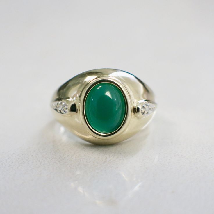 Metal: 14K Yellow Gold Chrysoprase Chalcedony: 8 x 6 MM Diamonds: .01 CTW SI2 G-H Size: 6 For a greater selection of jewelry please visit our website at www.BlackMarketLLC.com If you have any questions about this product or if we can help you with any of our other products please contact us through Etsy or our website at www.blackmarketllc.com. Each piece of our jewelry has been identified by our Graduate Gemologist certified by the Gemological Institute of America (GIA). For more information ab Fine Jewelry Green Cabochons For Formal Occasions, Heirloom Green Oval Opal Ring, Green Cabochons For Formal Fine Jewelry, Classic Green Signet Ring For Anniversary, Green Opal Gemstone Ring For Formal Occasions, Yellow Gold Emerald Ring With Chrysoprase For Anniversary, Green Signet Ring With Polished Finish For May Birthstone, Green Oval Cabochon Ring For Anniversary, Green Cabochon Emerald Ring For Anniversary