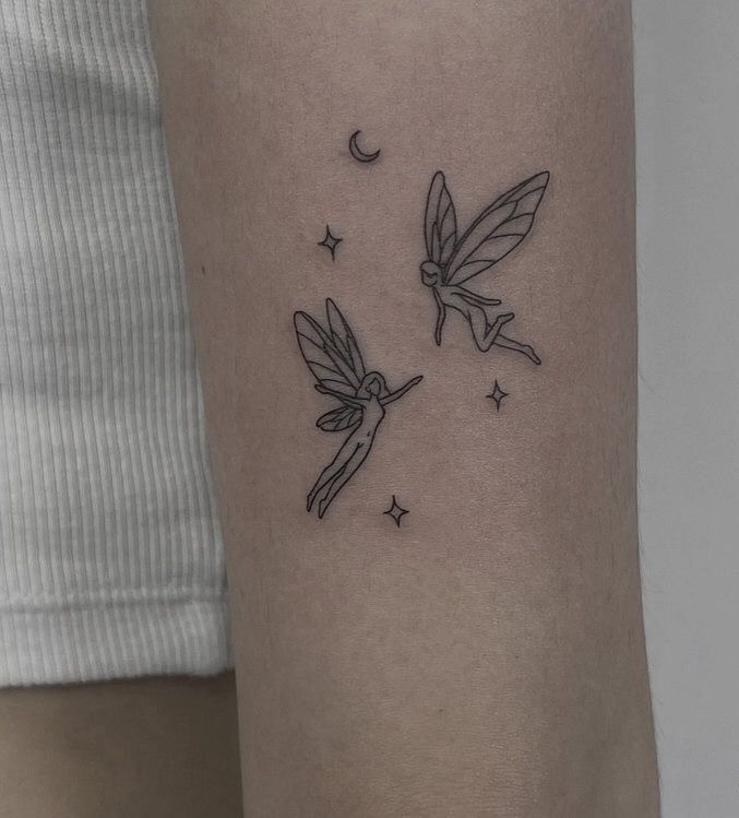 a couple of small tattoos on the arm