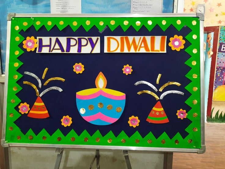 a happy diwal sign is on display in a classroom