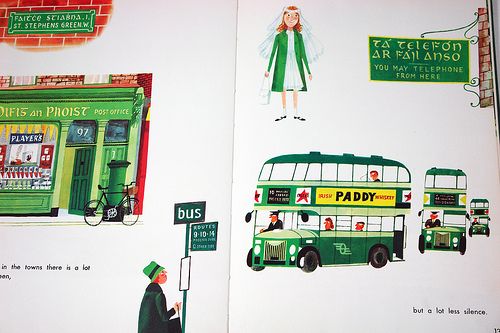 an open book with illustrations of people and buses