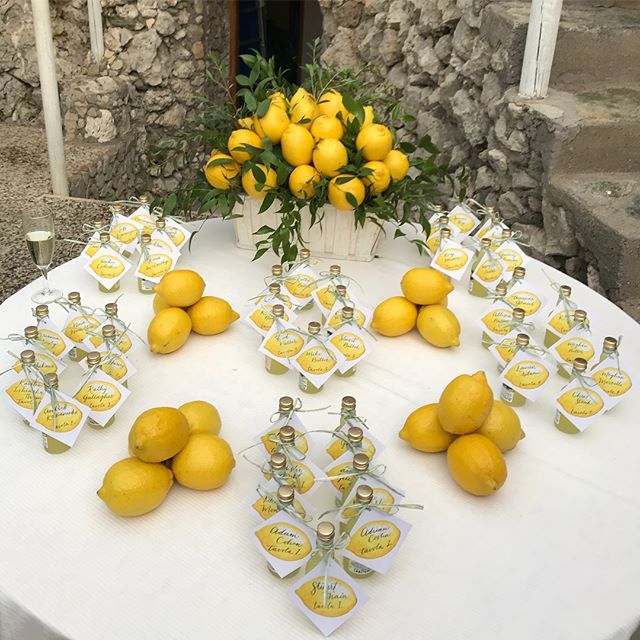 a table with lemons and bottles on it