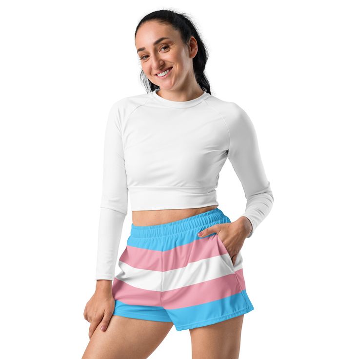 Add these cute transgender flag shorts to your trans pride wardrobe. These trans flag shorts are a great way to show off your transgender pride and gender identity. Not only are they super cool for pride events and festivals, they are functional athletic shorts made for swimming, running and other sporting activities and you'll won't want to be without them when heading to the beach or lounging by the pool. You'll also appreciate the mesh pockets large enough to hold your phone. DETAILSComfortable elastic waistband with a flat white drawstringDeep mesh side-pocketsWater-repellent microfiber fabricMoisture wickingBreathable & fast dryingUPF50+ protectionMATERIAL91% recycled polyester, 9% spandex (composition may vary by up to 3%)Model wears size MHeight 5.5 feet (165 cm), waist circumferenc White Shorts For Cheerleading, White Athletic Shorts For Cheerleading In Summer, White Athletic Shorts For Summer Cheerleading, White Pajama Shorts For Summer Sports, White Athleisure Shorts For Cheerleading, White Cheerleading Shorts For Summer, White Summer Cheerleading Shorts, White Athleisure Athletic Shorts For Cheerleading, Sporty Cheerleading Shorts For Summer