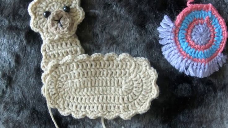 two crocheted items are laying next to each other