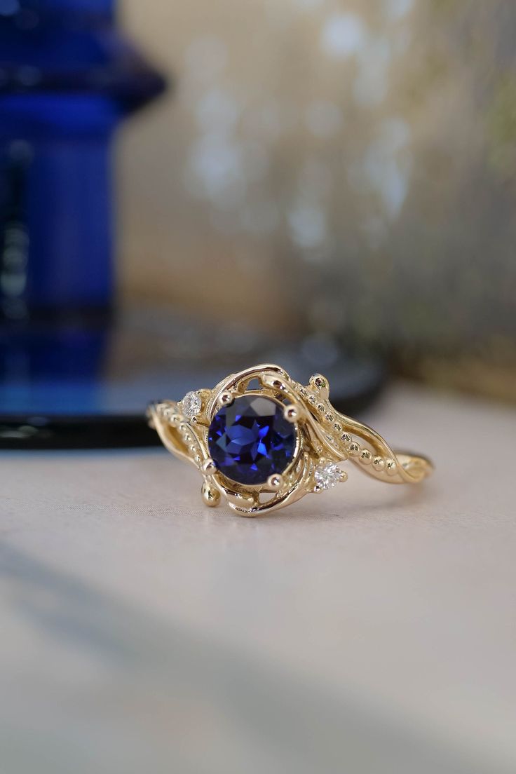 "If you have a problem with placing an order please reach us out for assistance: info@edengardenjewelry.com ✵ Learn more about us: www.edengardenjewelry.com ✵ E-mail: info@edengardenjewelry.com The name of this engagement ring style is of Latin origin meaning \"little wave\". Undina appears in European folklore as fairy-like creatures, this name may be used for a water nymph or water spirit.  Hypnotising flow of art nouveau style is a feature of this engagement ring. Wavy lines are adorned with Classic Sapphire Ring With Intricate Design, Wedding Sapphire Ring With Intricate Design, Sapphire Rings With Intricate Design, Elegant Sapphire Ring With Intricate Design, Intricate Blue Sapphire Ring, Yellow Rings, Traditional Engagement Rings, Round Cut Engagement Rings, Engagement Rings Round