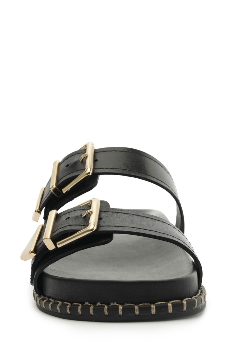 Gleaming buckles and a stitched welt add shine and texture to a weekend-ready slide sandal set on a contoured footbed for enhanced comfort. Leather upper/synthetic lining/leather sole Made in Brazil Modern Slip-on Footbed Sandals With Buckle Closure, Black Slide Sandals With Buckle Closure, Black Slide Mules With Buckle Closure, Leather Slides With Adjustable Strap, Flat Shape, Modern Black Slides With Buckle Closure, Modern Leather Slides With Buckle Closure, Chic Slides With Buckle Closure And Flat Heel, Modern Slide Mules With Buckle Closure, Leather Slip-on Slides With Buckle Closure