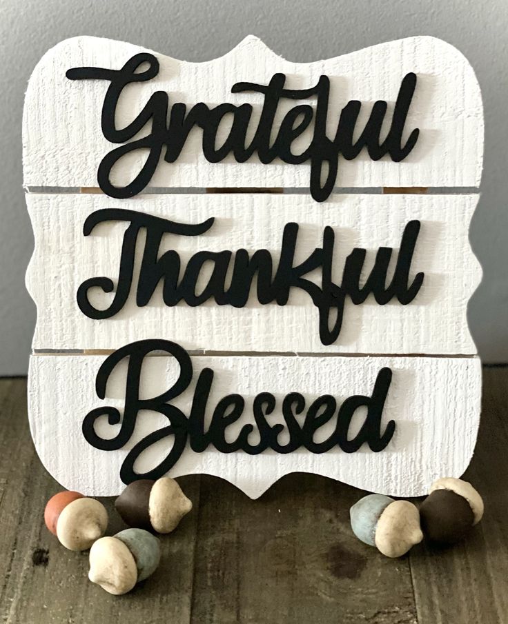 a wooden sign that says grateful and grateful