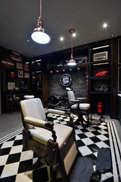 a room with black and white checkered flooring, two chairs and a desk