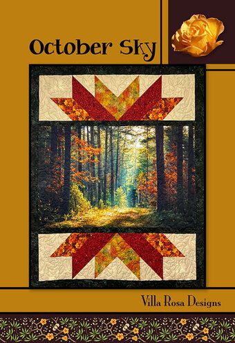 the cover of october sky quilt book, featuring an image of a forest with trees and leaves