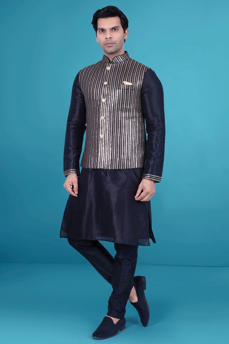 This kurta vest exudes sophistication with its understated sequin design. Perfect for a formal event or a special occasion, it adds a touch of luxury to any outfit. Elevate your style with this exclusive piece from our collection. Festive Formal Fitted Vest, Luxury Black Festive Kurta, Festive Fitted Vest With Zari Work, Sleeveless Nehru Jacket For Formal Festive Occasions, Fitted Festive Vest With Zari Work, Festive Sleeveless Nehru Jacket For Formal Occasions, Fitted Sleeveless Nehru Jacket For Festive Occasions, Festive Sleeveless Fitted Bandhgala, Fitted Nehru Jacket For Fall Party