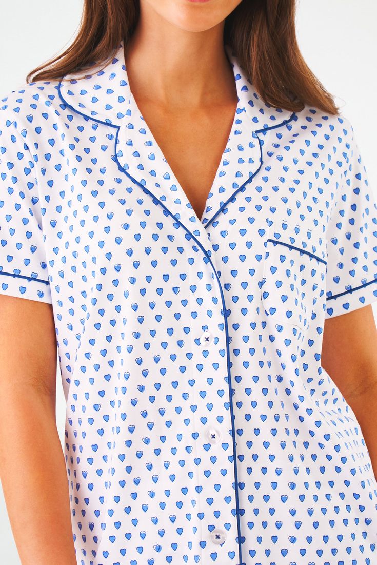 A little bit preppy, lots-of-bits cozy. Our 100% Cotton Polo Pajama Set keeps you cool all night long (in more ways than one)! Pair this with our Hearts Quilt, and you can't help but *heart* bedtime! 4 Buttons Breast Pocket Elastic Waist Materials and Care 100% Long-Staple Premium Cotton Machine Wash Cold, With Like Colors Do Not Bleach, Tumble Dry Low (Line Dry Recommended) Imported Measurement Information Model Wears Size Small Size S Length: 25.5" (from Shoulder) Size S Sleeve Length: 7" (fro Roller Rabbit Blue Hearts, Roller Rabbit Heart Pjs, Roller Rabbit Pjs, Hearts Quilt, Cute Pjs, Cute Pajama Sets, Roller Rabbit, Cute Pajamas, Sleepwear & Loungewear