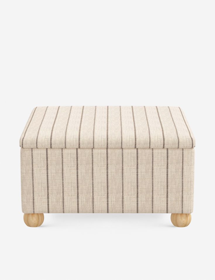 a beige and black striped ottoman with wooden legs, on a white background the foot rest is upholstered