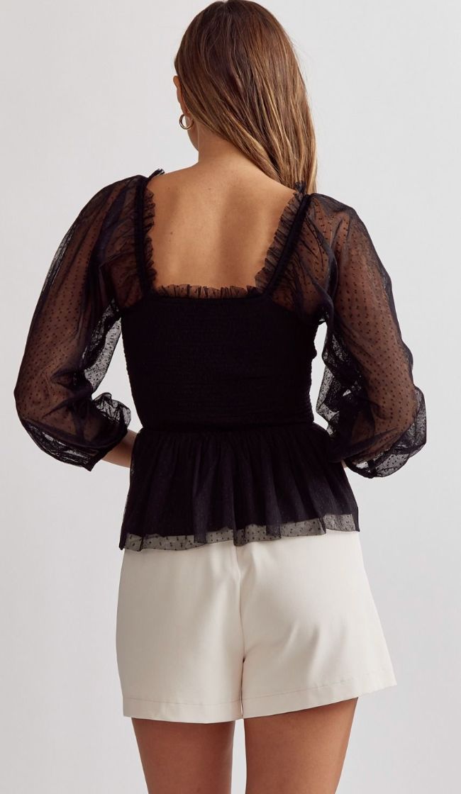 Elevate your style with our Kait Swiss Dot Top! Featuring a sheer fabric with delicate swiss dot detailing, this long sleeve top exudes femininity. The peplum style flatters your figure, while the smocked bodice ensures a perfect fit. Complete with a ruffle detail along the neckline, this top adds a touch of romance to any outfit. Perfect for any occasion, our Kait Swiss Dot Top is a must-have in your wardrobe! Details: Sheer Swiss dot long sleeve peplum top featuring a smocked bodice and ruffle Elegant Long Sleeve Mesh Top For Date Night, Sheer Long Sleeve Tops For Brunch, Long Sleeve Tops With Sheer Sleeves For Brunch, Fitted Long Sleeve Top With Swiss Dot Details, Fitted Swiss Dot Tops For Fall, Fitted Long Sleeve Tops With Swiss Dot, Long Sleeve Blouse With Lace Trim For Date Night, Chic Long Sleeve Lace Top, Feminine Long Sleeve Blouse With Swiss Dot