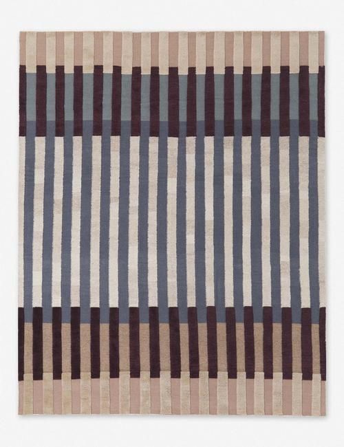 an area rug with different colored stripes on it