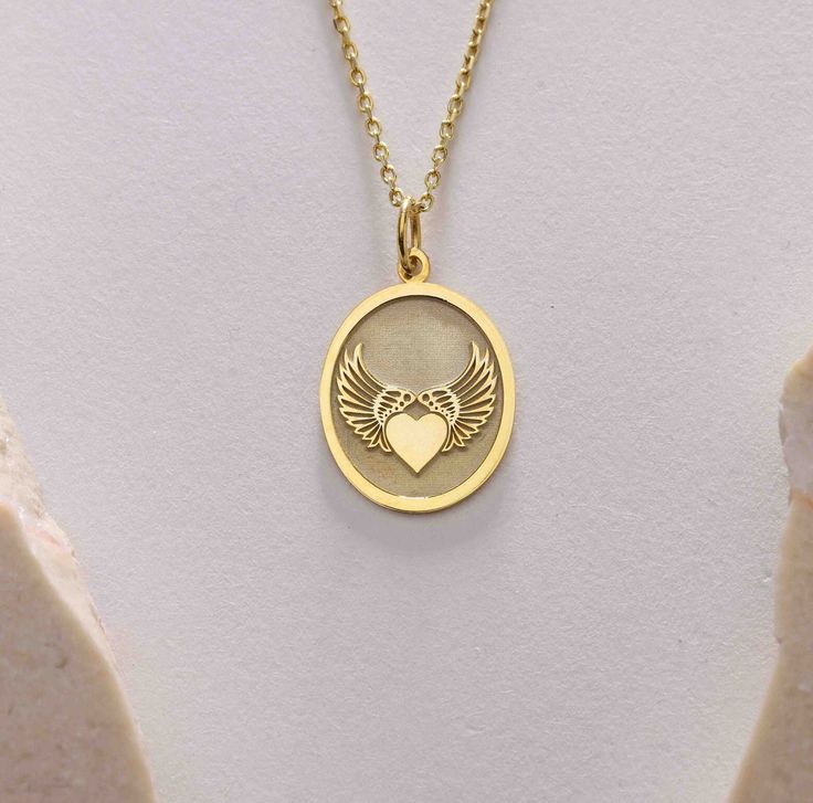 Gold Angel wing heart Pendant - Angel wing heart Gold Necklace ● Material of pendant: Solid Gold 14k ( REAL GOLD ) ● Metal Stamp: 14k ( REAL GOLD ) ● The pendant is available in 5sizes: - 12x17 mm / 0,47 x 0,66 inches - 13x18 mm / 0,51 x 0,70 inches  In the photos - 14x19 mm / 0,55 x 0,74 inches  - 16x21 mm / 0,62 x 0,82 inches  - 18x24 mm / 0,70 x 0,94 inches ( In the photos the size is 13x18 mm / 0,51 x 0,70 inches ) ( Jump Ring inner diameter: 4 mm ) ● Material of chain: Solid gold 14k ( REAL GOLD ) It is thin and dainty and it is available in 4 sizes: - 40 cm / 15,75 inches ( Length ) - 45 cm / 17,72 inches ( Length ) In the photos - 50 cm / 19,68 inches ( Length ) - 55 cm / 21,65 inches ( Length ) ● Backside engraving is FREE ( Please use the personalization box for that.) ● If you wa Angel Wings Heart, Gold Angel Wings, Angel Wing Necklace, Angel Wing Pendant, Gold Angel, Angel Pendant, Wing Necklace, Gold Heart Necklace, Gold Birthday