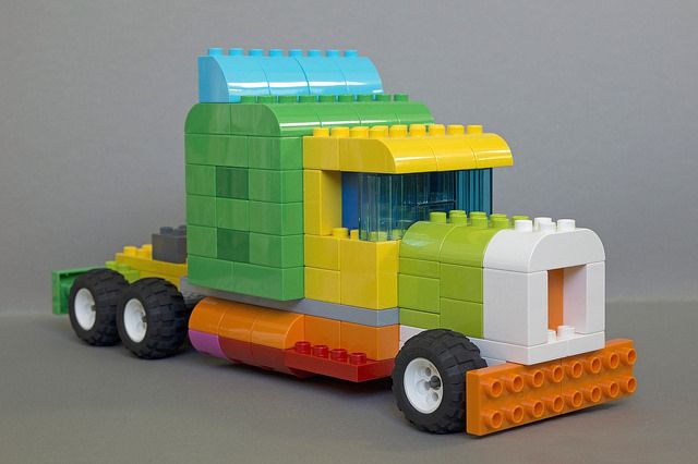 a toy truck made out of lego blocks