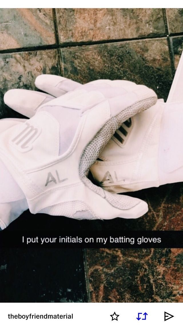 a pair of white gloves sitting on top of a tile floor