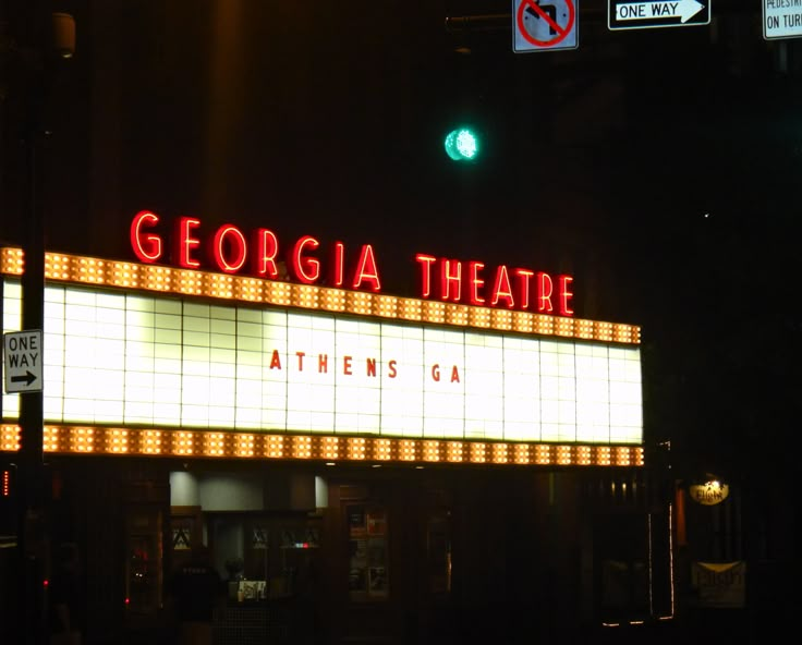 a sign that reads georgia theatre at night