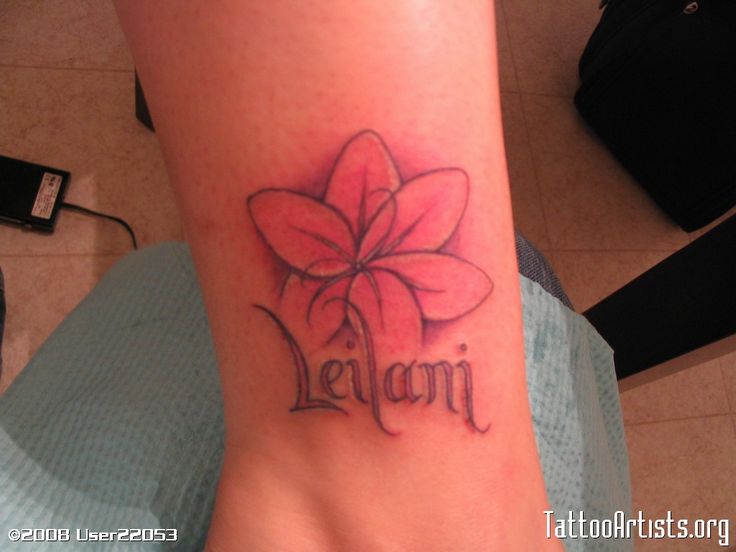 a tattoo with the word leon written in cursive writing and a flower on it