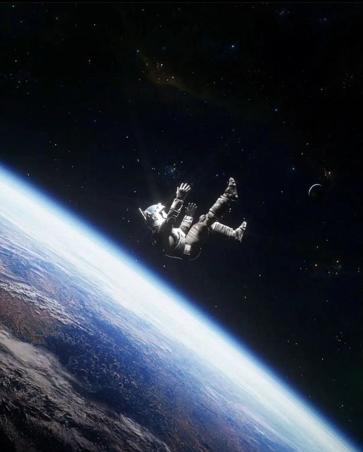 an astronaut floating in space above the earth