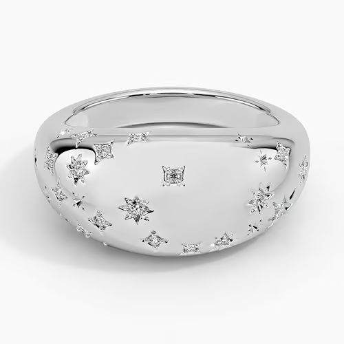 a white gold ring with stars and diamonds on the side, set in 18k white gold