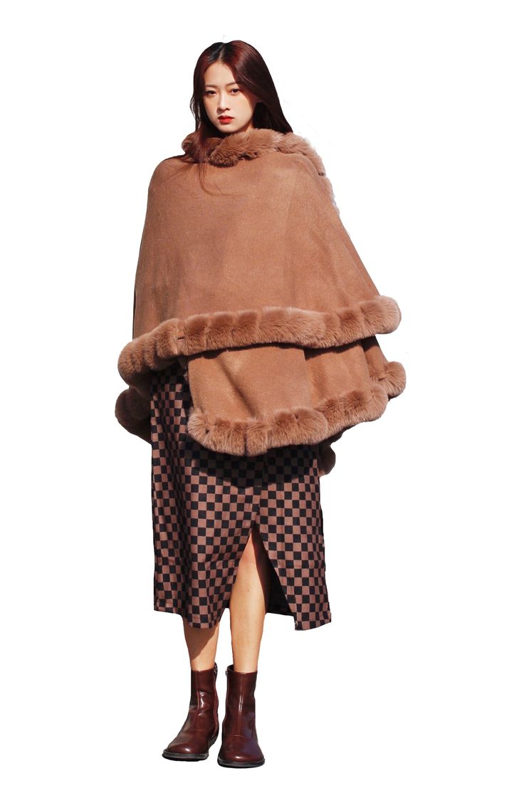 Add a toasty yet glam finish to your elegant ensemble with this draped cape that is trimmed with faux fur. Open front Short sleeves Shell/faux fur: 100% polyester
 Hand wash, line dry Imported Fall Cape Fur Coat With Faux Fur Trim, Winter Cape-shaped Faux Fur Coat, Elegant Fur Cape Coat With Faux Fur Trim, Elegant Cape Fur Coat With Faux Fur Trim, Faux Fur Winter Cape Coat, Elegant Fur Coat With Faux Fur Trim Cape, Winter Faux Fur Cape Coat, Winter Faux Fur Poncho With Trim, Winter Poncho With Faux Fur Trim